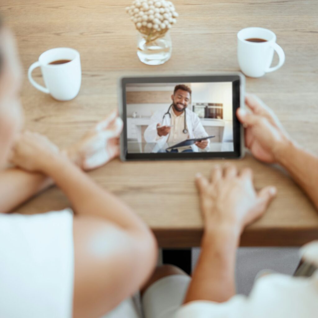 Couple, telehealth doctor and tablet video call, healthcare consulting and virtual service for medi